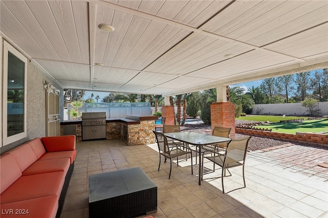 view of patio with area for grilling, outdoor lounge area, and grilling area