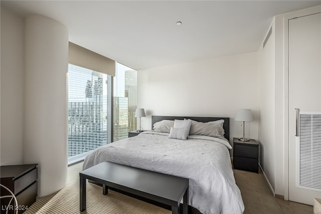 bedroom with light colored carpet