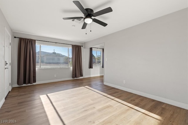 unfurnished room featuring wood-type flooring and ceiling fan