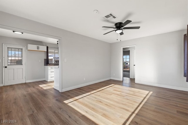 spare room with ceiling fan and dark hardwood / wood-style floors