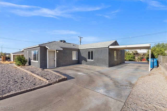 view of front of home featuring a carport