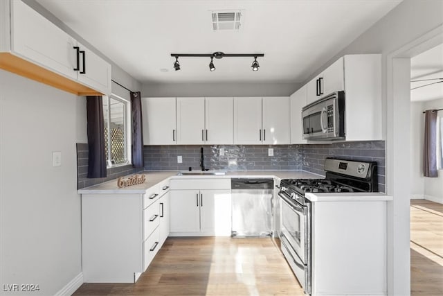 kitchen featuring white cabinetry and stainless steel appliances