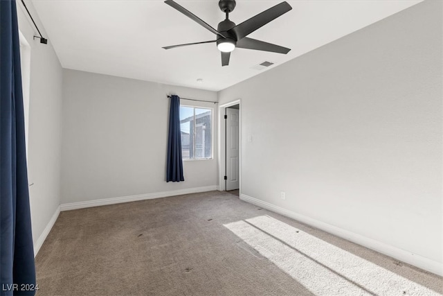 carpeted empty room with ceiling fan