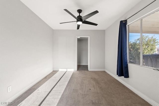 carpeted empty room with ceiling fan