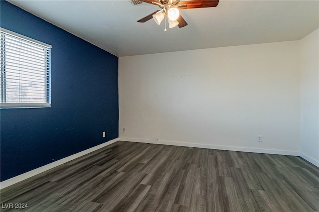 unfurnished room with ceiling fan, vaulted ceiling, and dark hardwood / wood-style floors