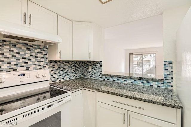 kitchen featuring white cabinets, white electric stove, backsplash, and dark stone counters