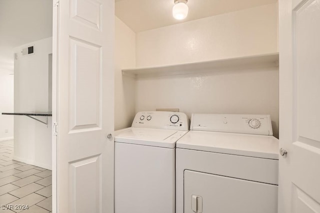 laundry room featuring washing machine and dryer