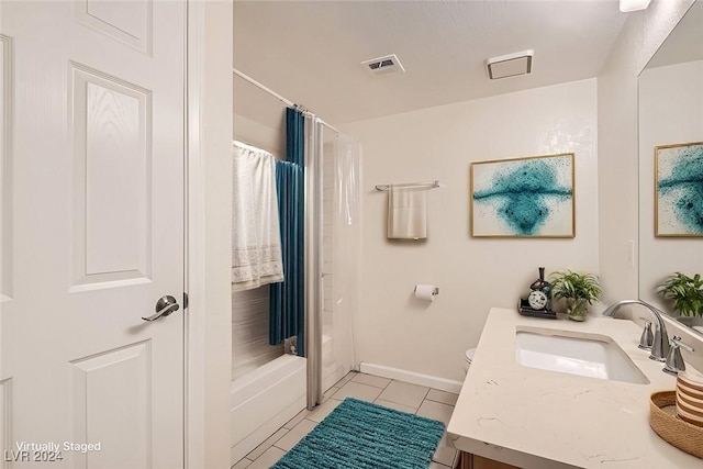 full bathroom featuring toilet, tile patterned floors, vanity, and shower / bath combo with shower curtain