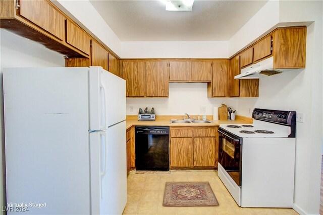 518 Elm St Unit H, Boulder City, NV 89005 - kitchen with white appliances, a sink, light countertops, under cabinet range hood, and brown cabinetry