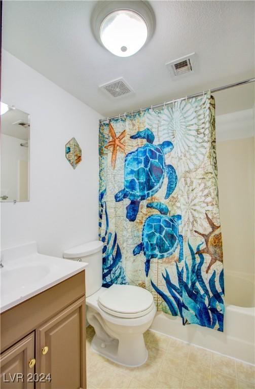 518 Elm St Unit H, Boulder City, NV 89005 - bathroom with vanity, toilet, and shower / bathtub combination with curtain