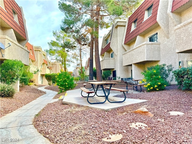 view of home's community with a patio area