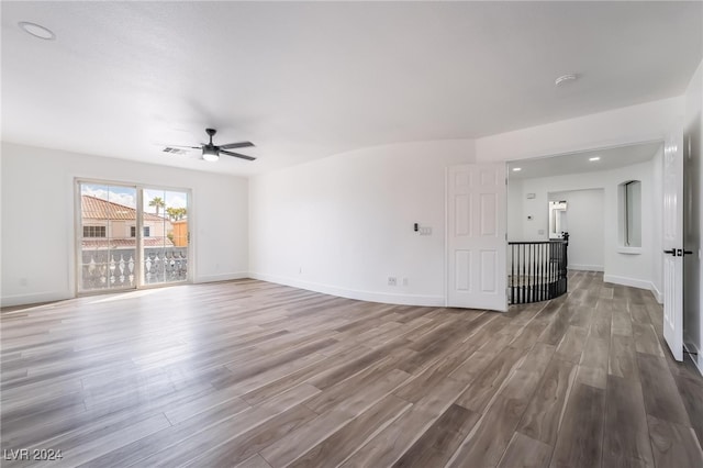 unfurnished living room with hardwood / wood-style flooring and ceiling fan