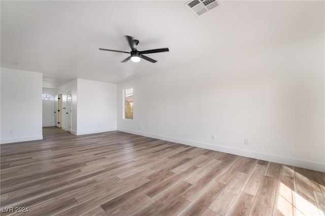 spare room with ceiling fan and light hardwood / wood-style floors