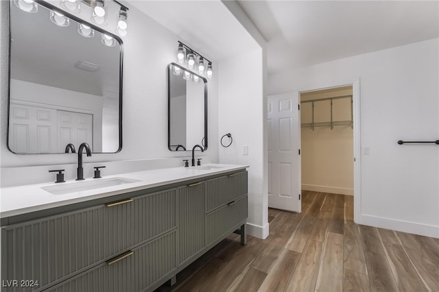 bathroom with vanity and hardwood / wood-style floors