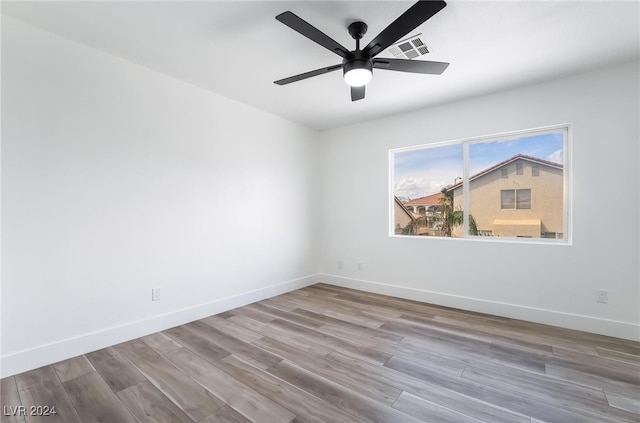 unfurnished room with ceiling fan and light hardwood / wood-style flooring