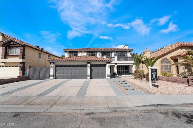 mediterranean / spanish-style house with a garage