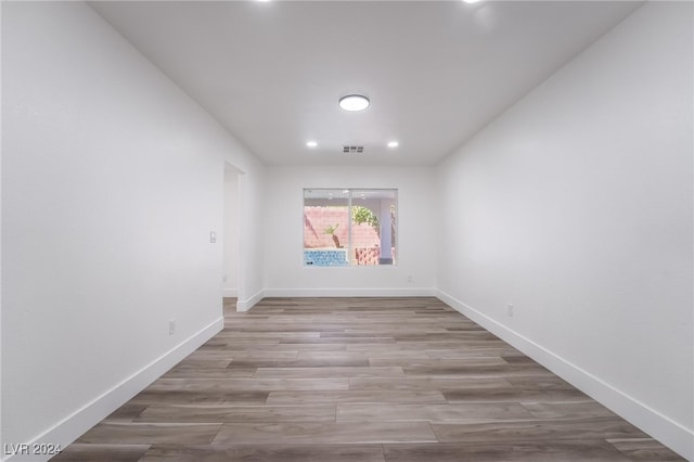 spare room with light hardwood / wood-style flooring