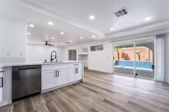 kitchen featuring stainless steel dishwasher, light hardwood / wood-style floors, white cabinetry, and sink