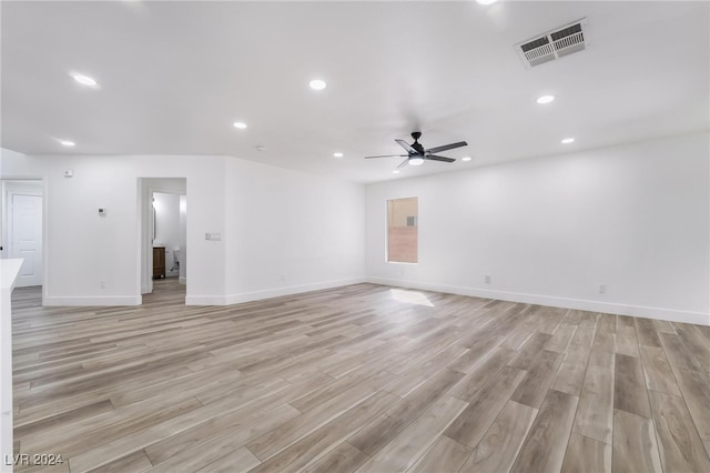 unfurnished living room with ceiling fan and light wood-type flooring