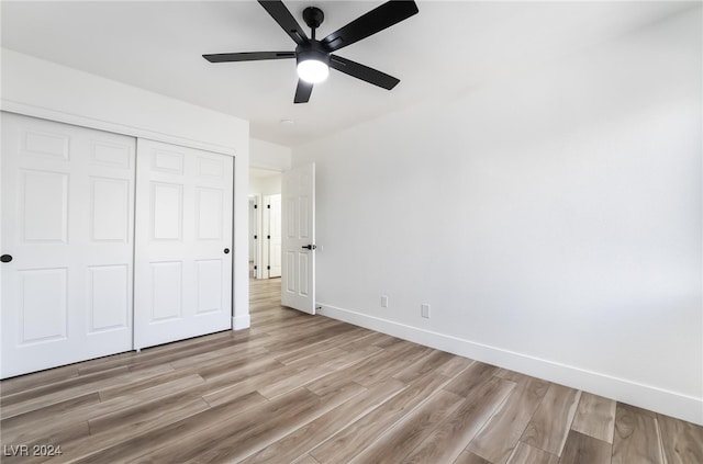 unfurnished bedroom with a closet, ceiling fan, and light hardwood / wood-style floors