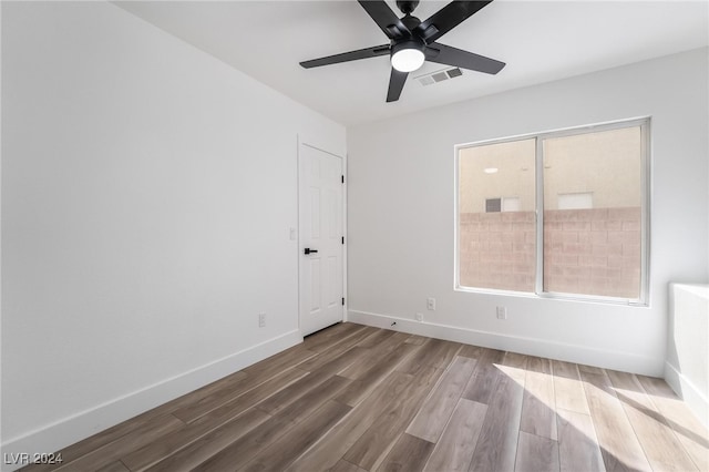 empty room featuring hardwood / wood-style flooring and ceiling fan