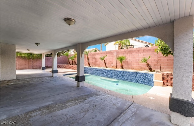 view of patio with a jacuzzi