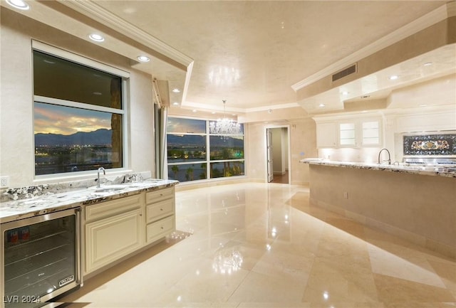 9103 Alta Dr Unit 401, Las Vegas, NV 89145 - bar area with wine cooler, crown molding, a chandelier, a sink, and recessed lighting