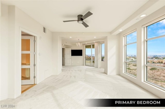 9103 Alta Dr Unit 401, Las Vegas, NV 89145 - unfurnished living room featuring light colored carpet, a chandelier, baseboards, ceiling fan, and recessed lighting