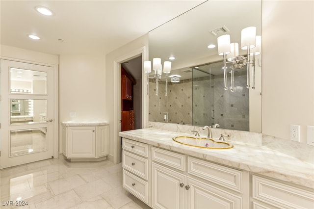 bathroom with an enclosed shower and vanity