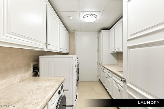 9103 Alta Dr Unit 401, Las Vegas, NV 89145 - laundry area featuring washer and dryer and cabinet space