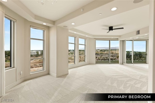 9103 Alta Dr Unit 401, Las Vegas, NV 89145 - unfurnished bedroom featuring carpet, recessed lighting, a tray ceiling, baseboards, and a ceiling fan