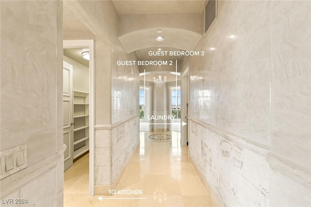 9103 Alta Dr Unit 401, Las Vegas, NV 89145 - hall with a chandelier, light tile patterned flooring, and vaulted ceiling