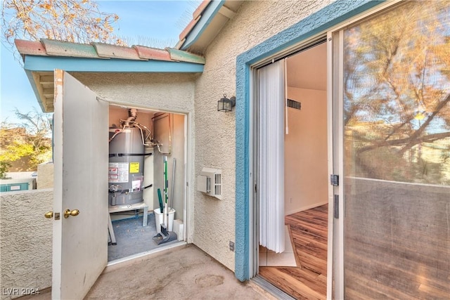 doorway to property featuring stucco siding