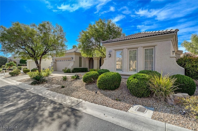 mediterranean / spanish-style home featuring a garage