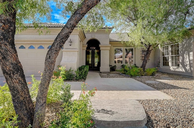 mediterranean / spanish-style home featuring a garage