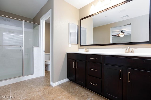 bathroom featuring walk in shower, ceiling fan, vanity, and toilet