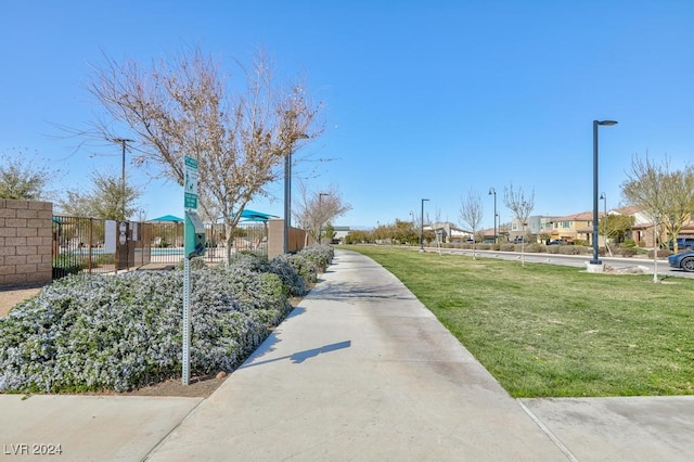 view of home's community featuring a lawn