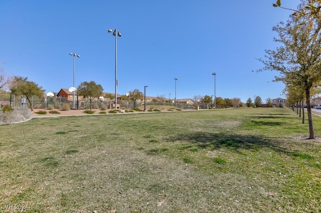 view of property's community with a lawn