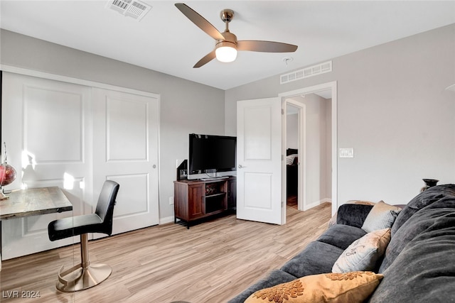 office featuring ceiling fan and light hardwood / wood-style flooring