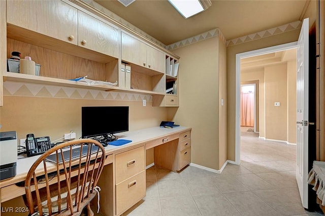 tiled home office featuring built in desk