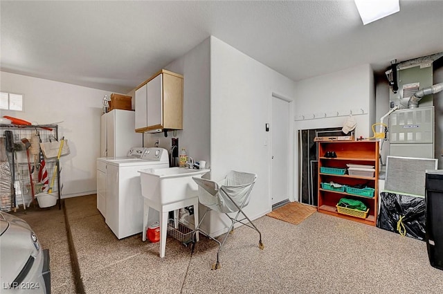 laundry area featuring cabinets and washer / dryer