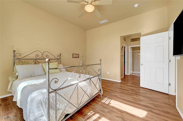 bedroom with hardwood / wood-style flooring and ceiling fan