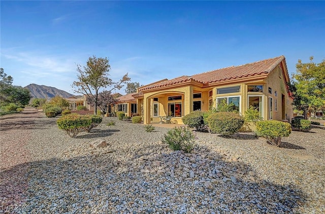 view of front of property with a mountain view