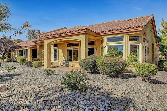 rear view of house featuring a patio area