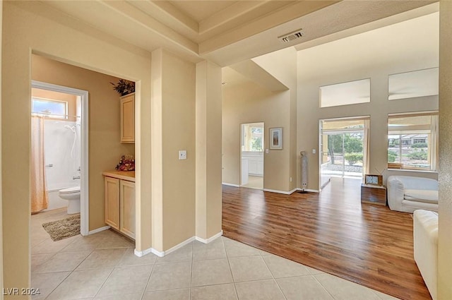 corridor with light tile patterned floors