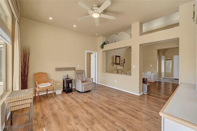 sitting room featuring light hardwood / wood-style flooring and ceiling fan