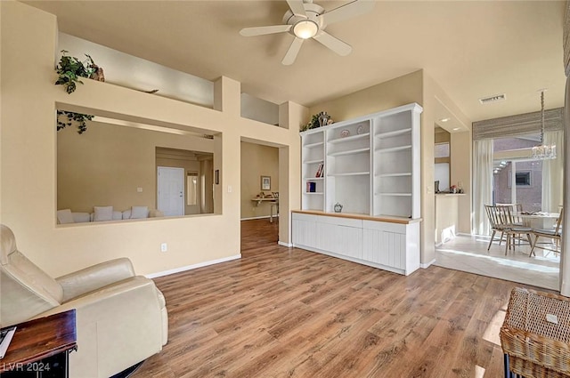 interior space with ceiling fan and wood-type flooring