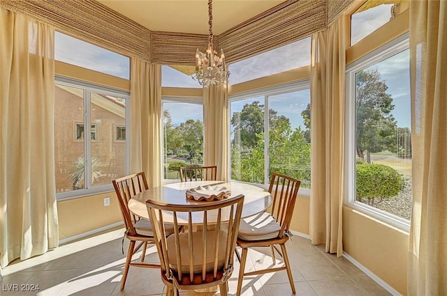 sunroom / solarium with an inviting chandelier