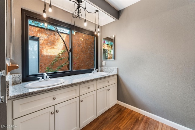 bathroom with vanity and hardwood / wood-style flooring