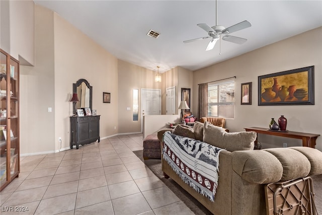 tiled living room featuring ceiling fan